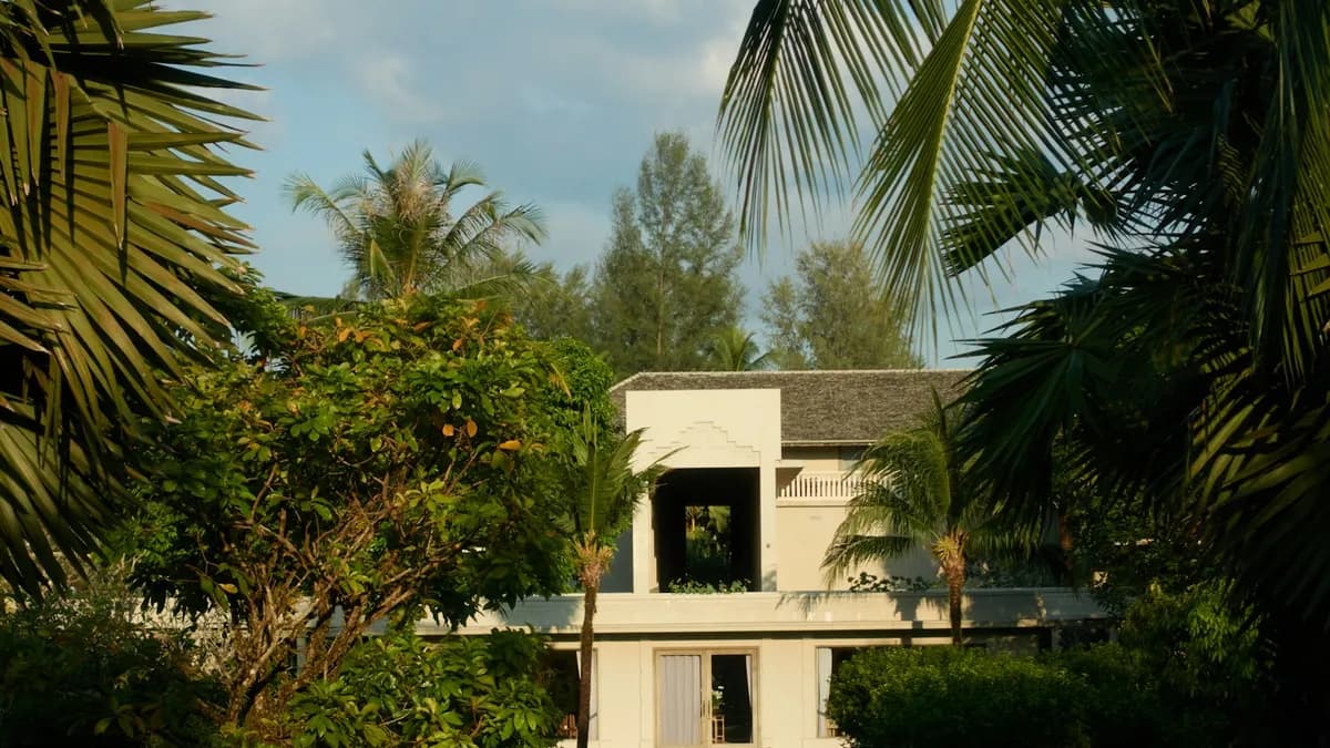 Modern retreat villa surrounded by tropical palms and greenery